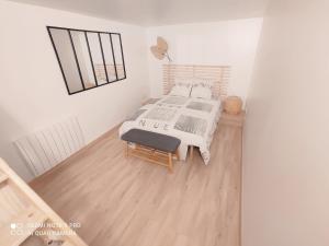 Ένα ή περισσότερα κρεβάτια σε δωμάτιο στο Le Petit Nogentais