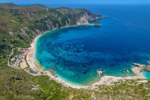 an aerial view of a beach and the ocean at Petani Bay Hotel - Adults Only in Vóvikes
