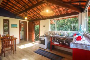 a kitchen with a stove and a counter top at Pipa Surf Yoga in Pipa