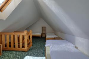 Postel nebo postele na pokoji v ubytování RAMZOVKA - bývalý penzion Anna
