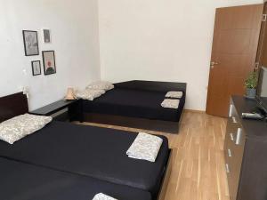 a small room with two beds and a couch at Петрови in Chernomorets