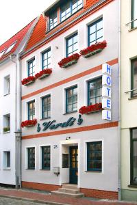 
a large building with a large window on the side of it at Hotel Verdi in Rostock
