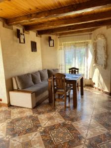 a living room with a couch and a table at Sofiya in Mykulychyn
