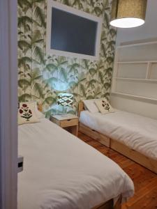 En eller flere senge i et værelse på Bonito piso en Gijon Centro Playa