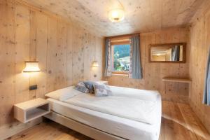 Posteľ alebo postele v izbe v ubytovaní Appartamento Nonna Engadina Chalet