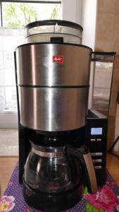 a coffee pot sitting on top of a coffee maker at Warmińskie Mieszkanko in Biskupiec