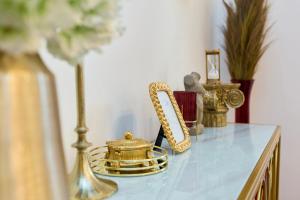a table with gold items on top of it at Old town Casa Nevia Dubrovnik in Dubrovnik