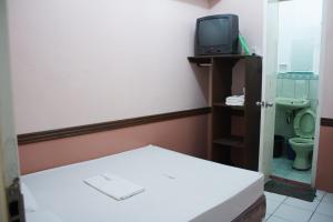 A television and/or entertainment centre at GV Hotel - Catarman