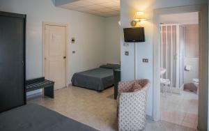 Postel nebo postele na pokoji v ubytování Eden Beach Club