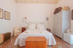 Posteľ alebo postele v izbe v ubytovaní B&B Il Melograno Taranto