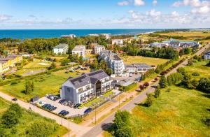 an aerial view of a town with the ocean at Apartamenty N7 in Darłówko