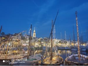 a group of boats docked in a marina at night at Villa Melbemar in Six-Fours-les-Plages