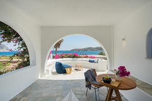 a living room with a couch and a table at KAMEO, Antiparos in Antiparos