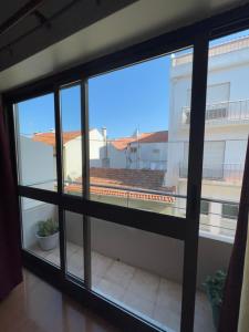 a view from the window of a balcony at Abrigo do Portinho in Vila Praia de Âncora +26 photos