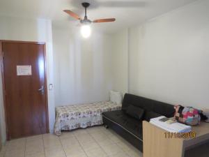 a living room with a couch and a ceiling fan at Hot Springs in Caldas Novas