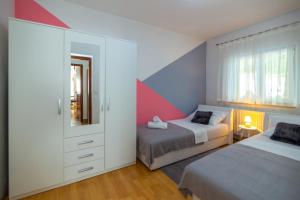 Postel nebo postele na pokoji v ubytování HOLIDAY HOME MARTINA, Vinjani - Imotski
