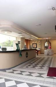 a lobby with a check in counter in a store at Hotel Casa Ballesteros in Barranquilla