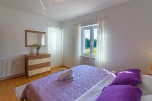 Postel nebo postele na pokoji v ubytování HOLIDAY HOME MARTINA, Vinjani - Imotski