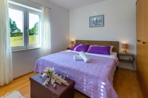 Postel nebo postele na pokoji v ubytování HOLIDAY HOME MARTINA, Vinjani - Imotski