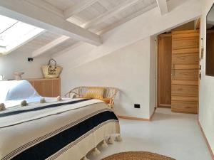 a bedroom with a large bed and a skylight at Santa Lucia Maccarese - Residenza Agricola in Maccarese