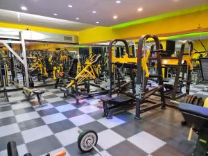 a gym with a lot of tread machines at Sognando Positano in Naples
