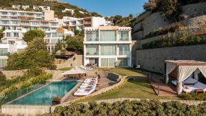 an aerial view of a resort with a swimming pool at Sirene Luxury Hotel Bodrum in Yalıkavak