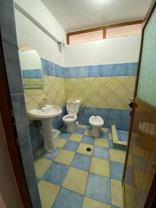 a bathroom with a toilet and a sink at Vila Tani in Ksamil +44 photos