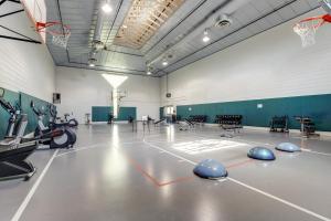 a gym with a basketball hoop and a basketball court at Sea Colony Pine Lake II in Bethany Beach