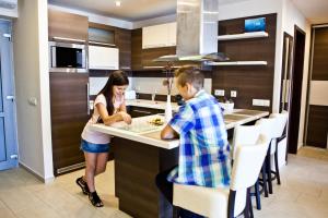 A kitchen or kitchenette at Németh Apartmanok