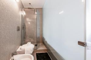 A bathroom at Amazing flat in Duomo by Easylife