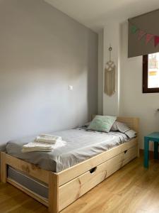 Giường trong phòng chung tại Apartamento Villa de Cartes