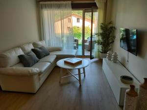 Posezení v ubytování Apartamentos Boutique Arquera Golf I