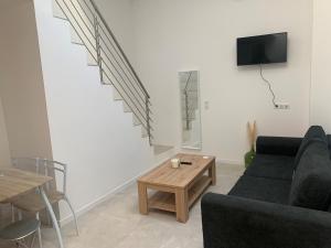Televízia a/alebo spoločenská miestnosť v ubytovaní Superbe Appartement Redon