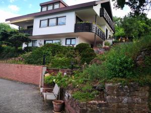 a house on top of a hill with plants at Apartment Lieblingsort in Kreuzwertheim