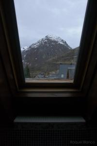 a window with a view of a snow covered mountain at Hotel Saueth in Tredós
