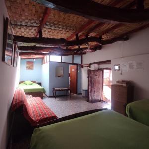 Cama ou camas em um quarto em Hostal Sonchek