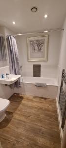 a bathroom with a sink and a toilet at Empress at College - Spacious 2 bedroom apartment in Southampton