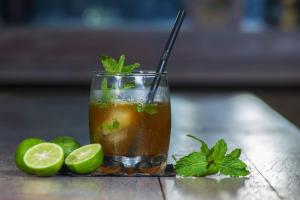 a drink with lime and mint on a table at Global Lodge Pemuteran in Pemuteran