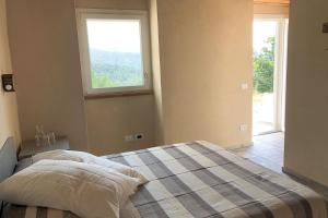 A bed or beds in a room at Agriturismo Cascina Cornelli
