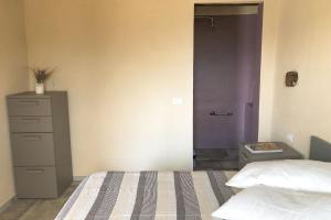 A bed or beds in a room at Agriturismo Cascina Cornelli