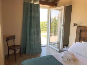 A bed or beds in a room at Agriturismo Cascina Cornelli