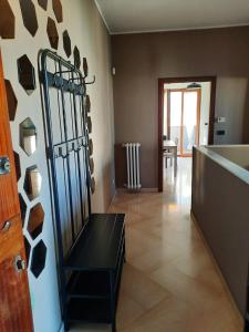 a living room with a black bench in a room at fronte mare in Giovinazzo +3 photos