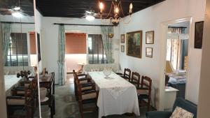 a dining room with a table and chairs at Greenfields Country Club in Limassol