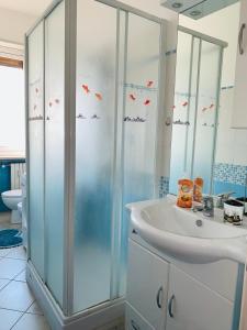 a bathroom with a shower and a sink at Casa Viola in Diano Marina