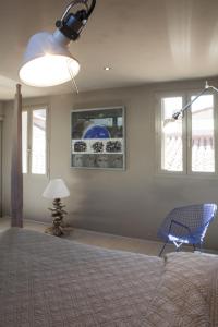 Кровать или кровати в номере La Loge de mer, Lodge urbain