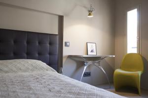 Кровать или кровати в номере La Loge de mer, Lodge urbain