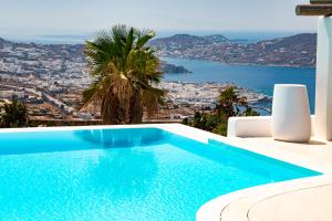 a swimming pool in a villa with a view at Diles Villas & Suites Mykonos in Tourlos