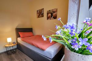 Postel nebo postele na pokoji v ubytování Ferienwohnung Mitten im Pott