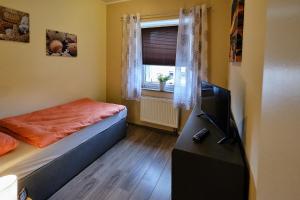 Postel nebo postele na pokoji v ubytování Ferienwohnung Mitten im Pott
