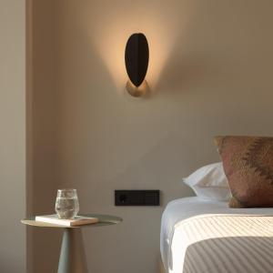 a bedroom with a bed and a table with a mirror at NERĒA Boutique Hotel in Plakias +46 photos